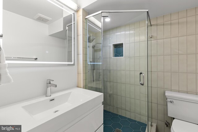919 French St NW, Washington, DC 20001 - bathroom with toilet, a shower stall, and tile patterned floors