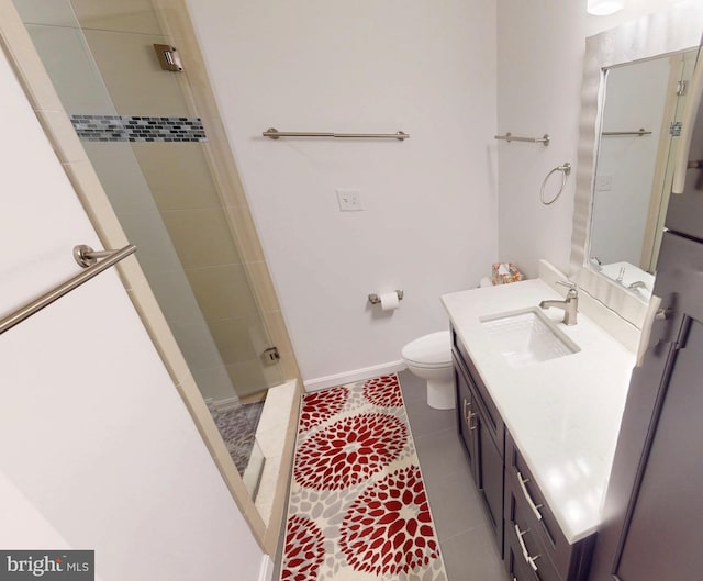 306 S Exeter St, Baltimore, MD 21202 - bathroom with a stall shower, vanity, toilet, tile patterned floors, and baseboards
