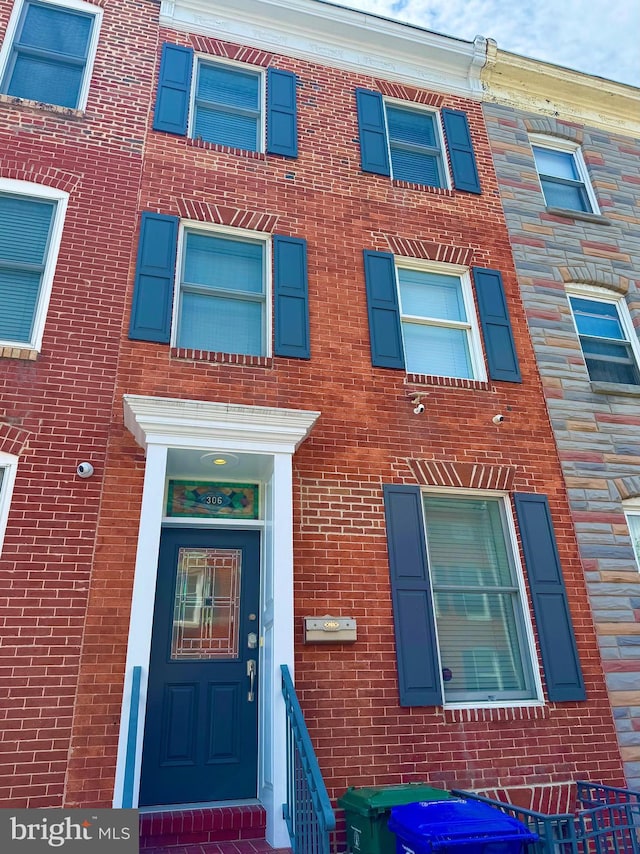 306 S Exeter St, Baltimore, MD 21202 - entrance to property with brick siding