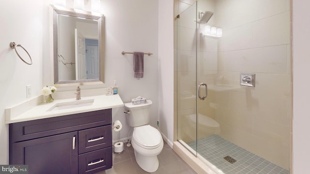 306 S Exeter St, Baltimore, MD 21202 - bathroom featuring a stall shower, toilet, tile patterned floors, and vanity
