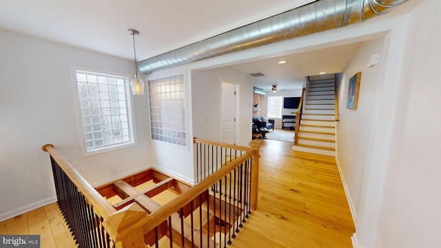 306 S Exeter St, Baltimore, MD 21202 - corridor featuring light wood-style flooring, healthy amount of natural light, baseboards, an upstairs landing, and recessed lighting