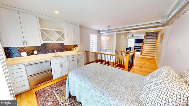 306 S Exeter St, Baltimore, MD 21202 - bedroom featuring light wood-type flooring, a sink, and recessed lighting