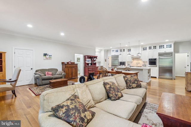 2277 Indian Holw, Winchester, VA 22603 - living area featuring light wood-style floors, recessed lighting, and crown molding