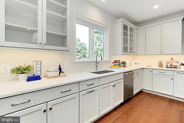7430 Foundation Way, Springfield, VA 22150 - kitchen with stainless steel dishwasher, dark wood-type flooring, light countertops, white cabinets, and recessed lighting