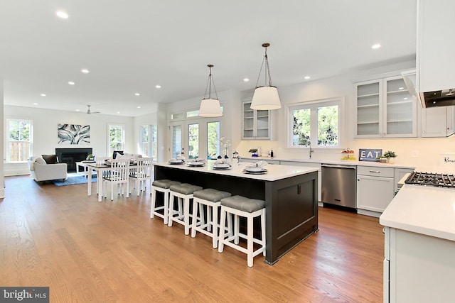 7430 Foundation Way, Springfield, VA 22150 - kitchen with stainless steel dishwasher, a center island, recessed lighting, healthy amount of natural light, and a breakfast bar