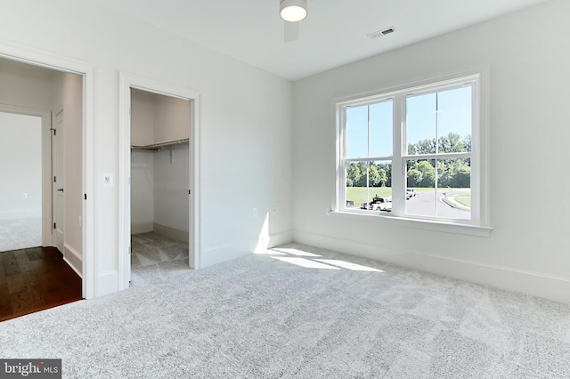 7430 Foundation Way, Springfield, VA 22150 - unfurnished bedroom with carpet floors, a spacious closet, a closet, and ceiling fan