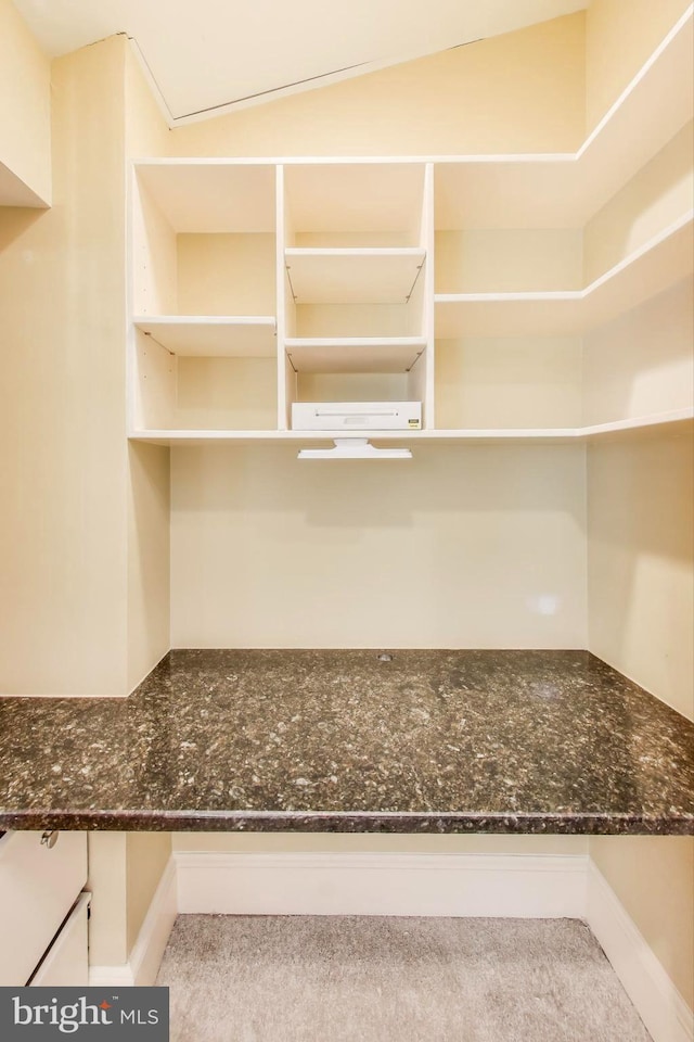 1324 10th St NW, Washington, DC 20001 - kitchen featuring open shelves, dark stone countertops, white cabinets, and a wall mounted AC