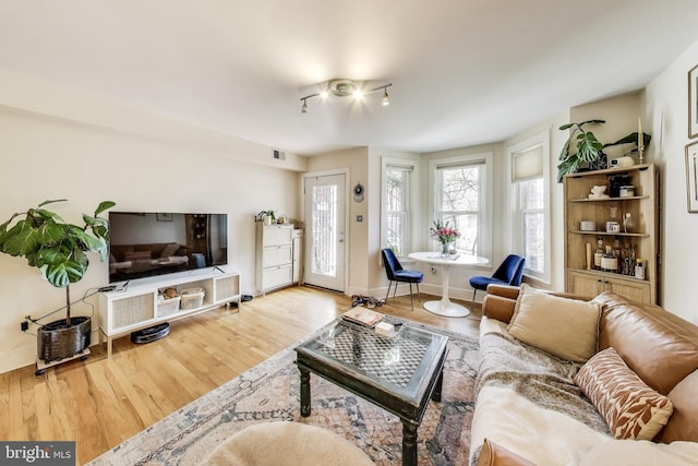 1324 10th St NW, Washington, DC 20001 - living room featuring wood finished floors and baseboards