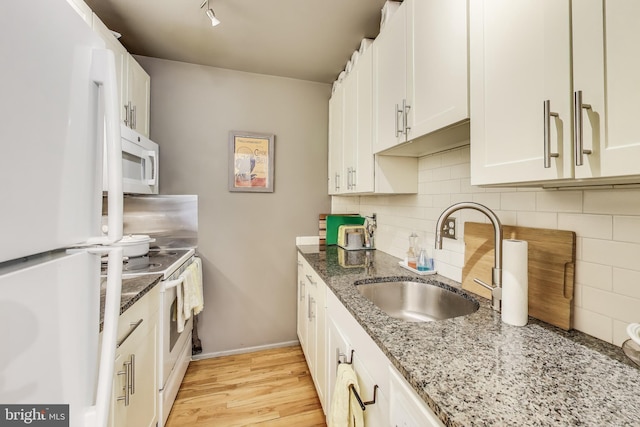 1324 10th St NW, Washington, DC 20001 - kitchen with white appliances, a sink, tasteful backsplash, and stone counters