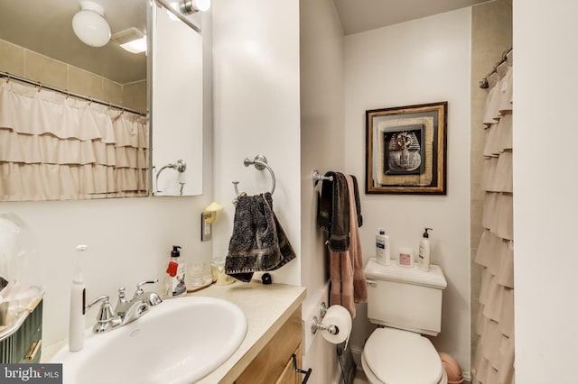1324 10th St NW, Washington, DC 20001 - full bath with vanity, toilet, and a shower with curtain