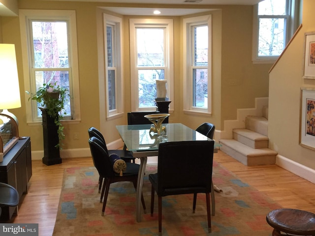 1324 10th St NW, Washington, DC 20001 - dining area featuring stairs, light wood finished floors, and baseboards
