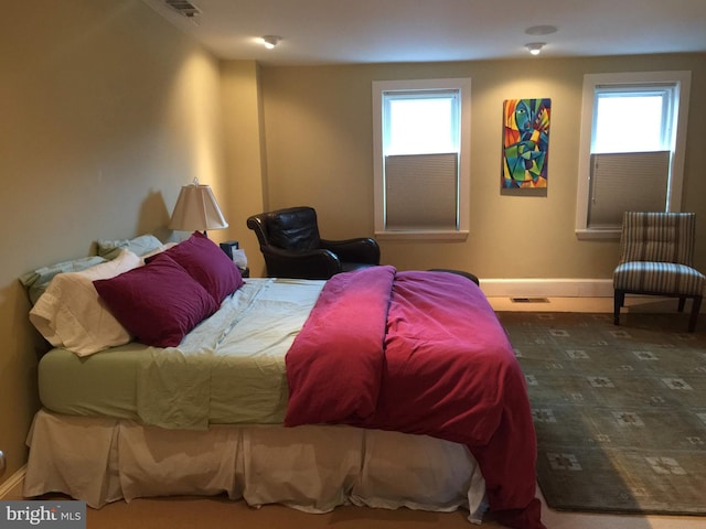 1324 10th St NW, Washington, DC 20001 - bedroom featuring multiple windows and baseboards