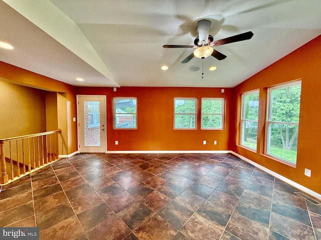 unfurnished room with lofted ceiling, ceiling fan, baseboards, and recessed lighting