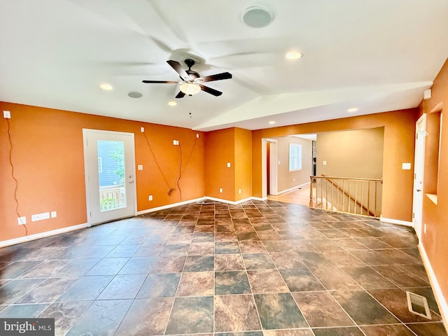 spare room with healthy amount of natural light, ceiling fan, baseboards, lofted ceiling, and recessed lighting