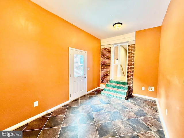 foyer featuring baseboards