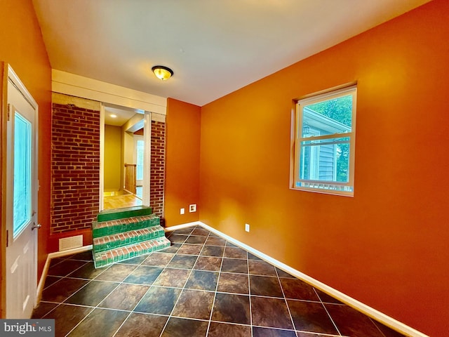 empty room featuring baseboards