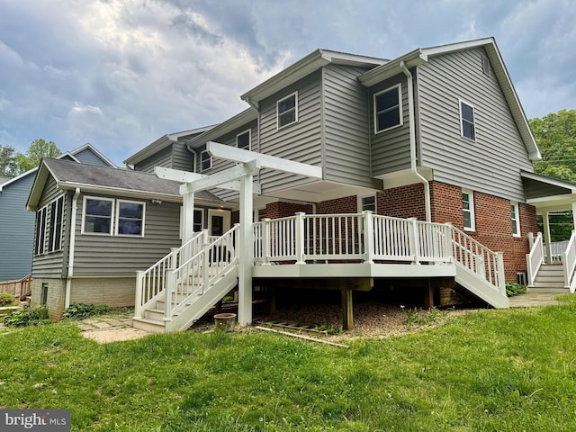 back of property with stairway, a lawn, and a deck