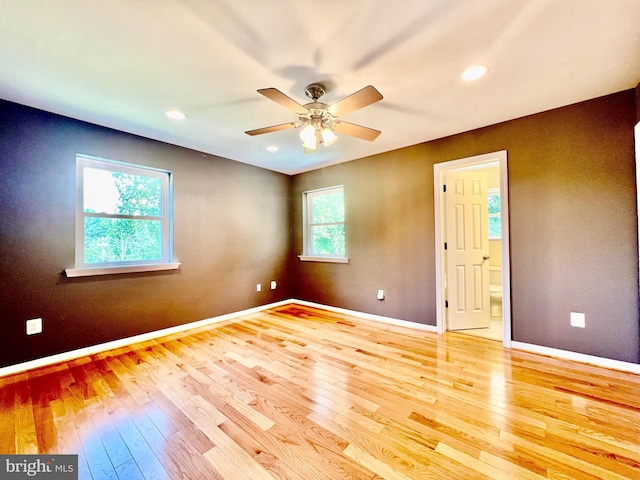 spare room with hardwood / wood-style floors, baseboards, a ceiling fan, and recessed lighting