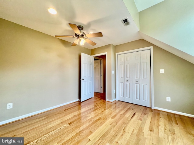 unfurnished bedroom featuring baseboards, a closet, and light wood-style floors