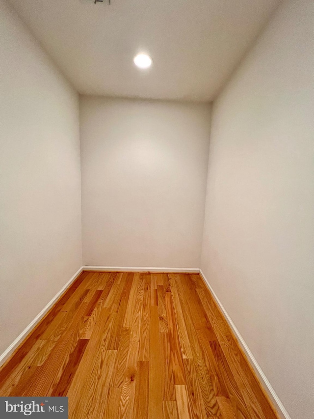 spare room with light wood-style flooring, baseboards, and recessed lighting