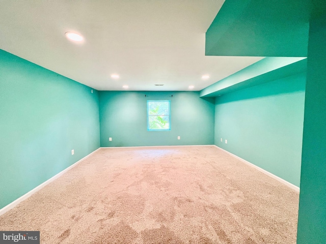 carpeted empty room with recessed lighting and baseboards
