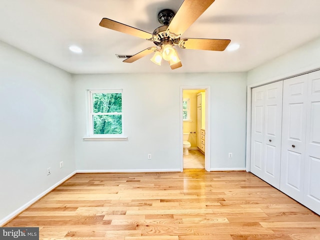 unfurnished bedroom with light wood-style floors, a closet, baseboards, recessed lighting, and connected bathroom