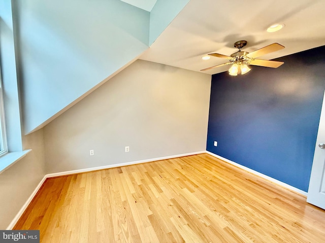 spare room featuring ceiling fan, wood finished floors, recessed lighting, and baseboards