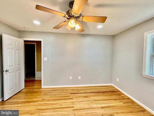 unfurnished room with light wood finished floors, baseboards, a ceiling fan, recessed lighting, and a smoke detector