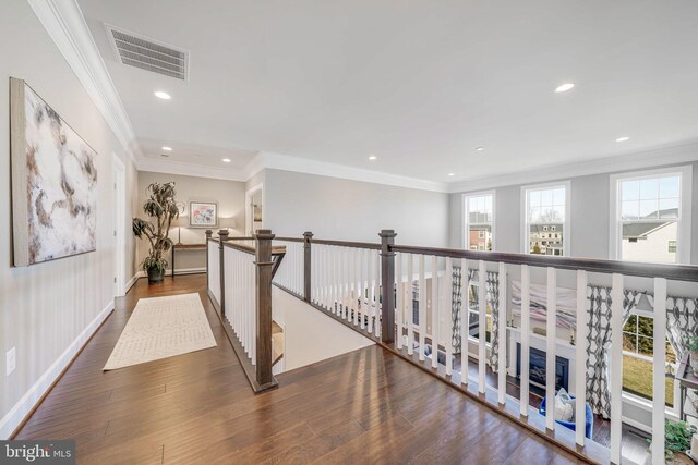 hallway with crown molding, wood finished floors, recessed lighting, an upstairs landing, and baseboards