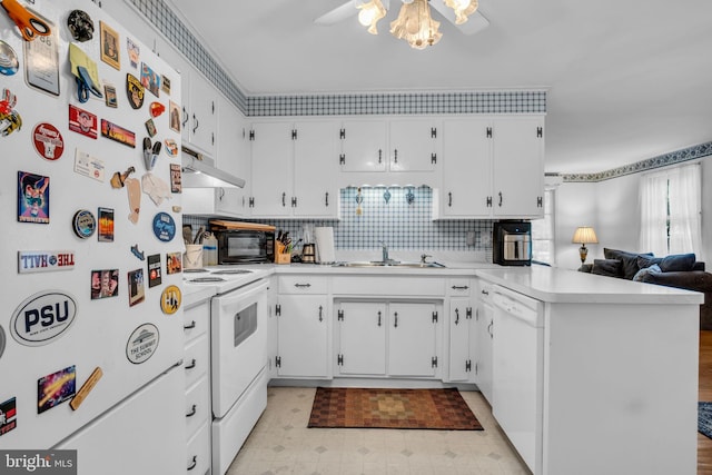 249 N Holly St, Elizabethtown, PA 17022 - kitchen with white appliances, a sink, a peninsula, under cabinet range hood, and light countertops
