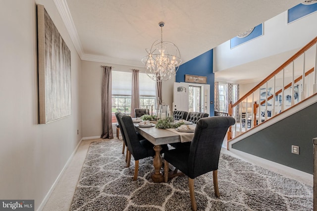 269 Bucktail Dr, Middletown, DE 19709 - carpeted dining space with a chandelier, stairway, baseboards, ornamental molding, and healthy amount of natural light
