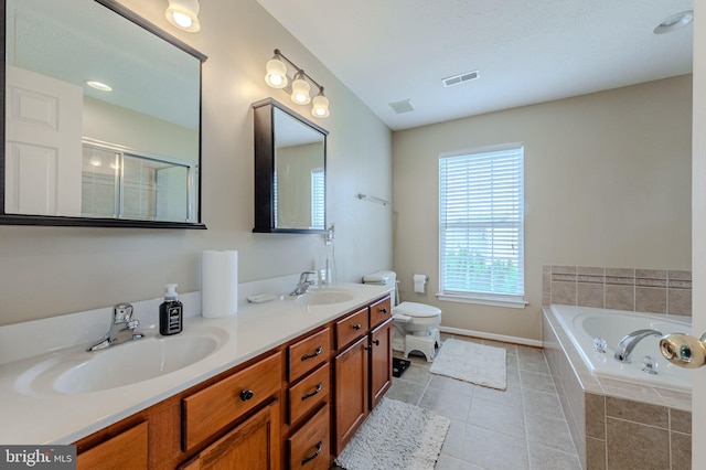 269 Bucktail Dr, Middletown, DE 19709 - bathroom with a bath, tile patterned floors, double vanity, toilet, and baseboards