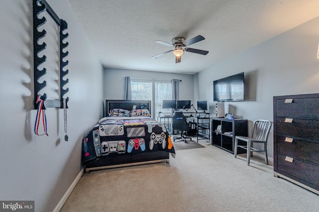 269 Bucktail Dr, Middletown, DE 19709 - carpeted bedroom featuring an office area, ceiling fan, a textured ceiling, and baseboards