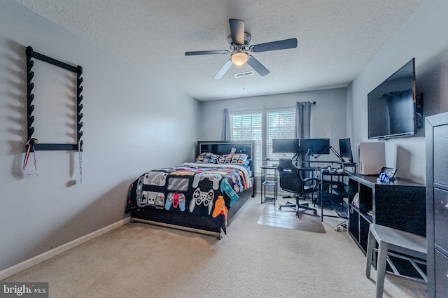269 Bucktail Dr, Middletown, DE 19709 - carpeted bedroom with a textured ceiling, a desk, ceiling fan, and baseboards