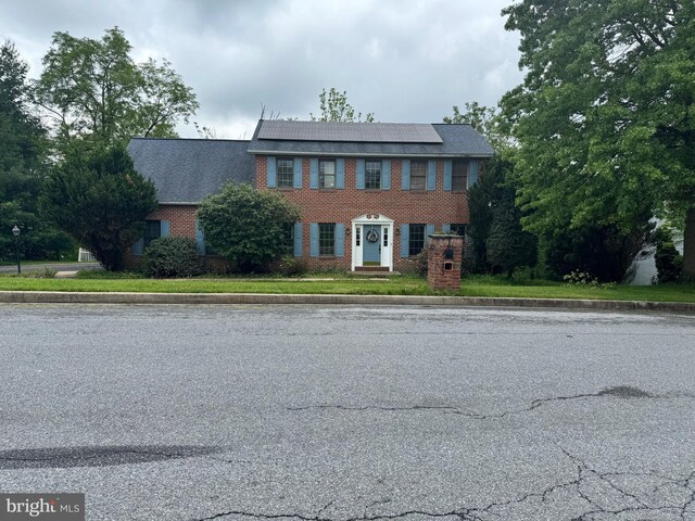 1600 Churchill Rd, Harrisburg, PA 17112 - colonial house with roof mounted solar panels and brick siding