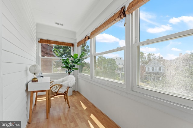 sunroom / solarium with wood finished floors