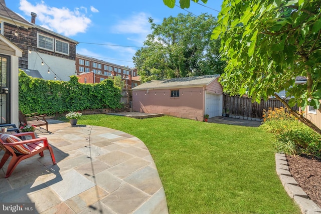 view of yard featuring an outbuilding and a patio area
