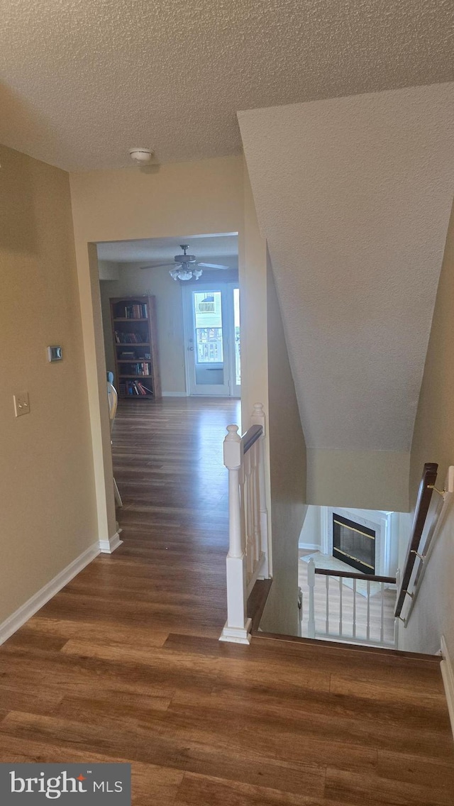38261 Yacht Basin Rd Unit 35, Ocean View, DE 19970 - hall featuring wood finished floors, a textured ceiling, and an upstairs landing