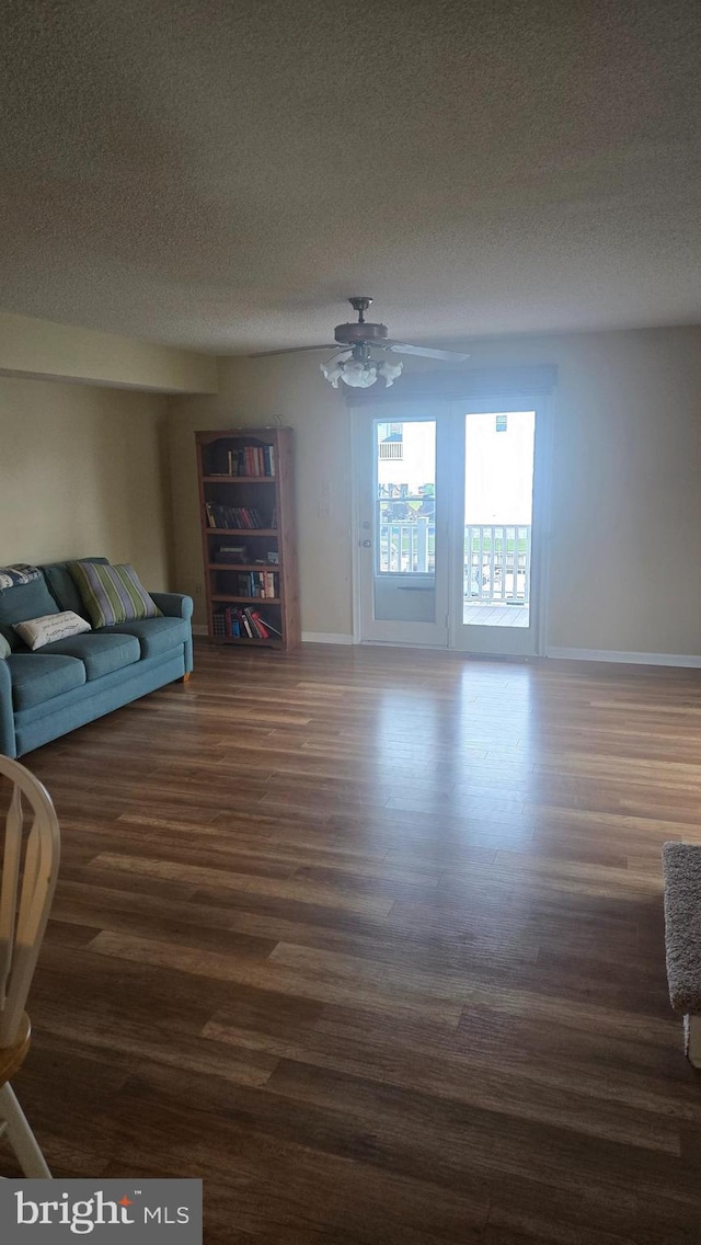 38261 Yacht Basin Rd Unit 35, Ocean View, DE 19970 - living area with dark wood-style floors, a textured ceiling, and a ceiling fan