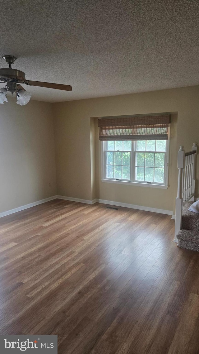 38261 Yacht Basin Rd Unit 35, Ocean View, DE 19970 - unfurnished room featuring wood finished floors, a ceiling fan, and a textured ceiling
