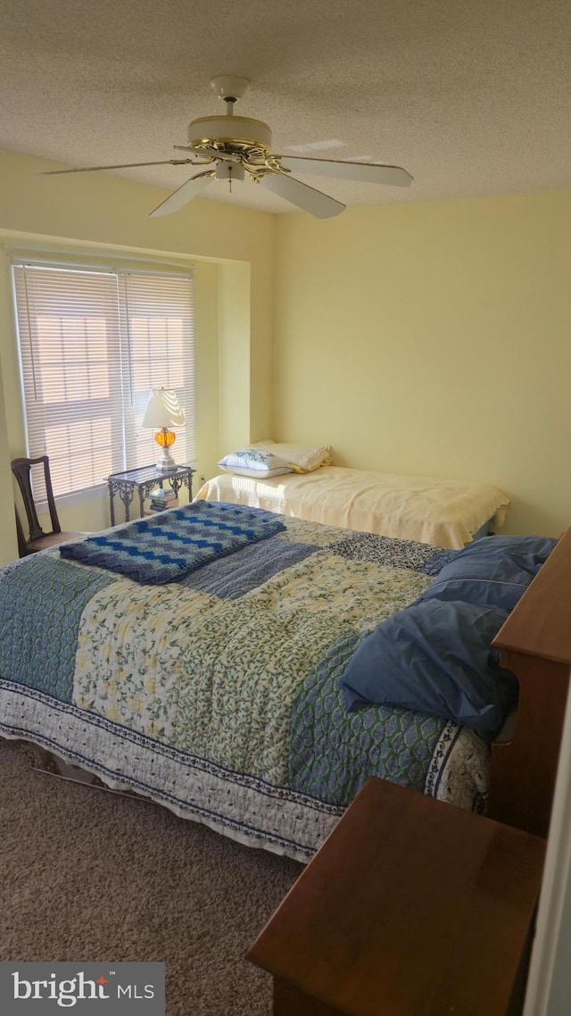 38261 Yacht Basin Rd Unit 35, Ocean View, DE 19970 - carpeted bedroom featuring a textured ceiling and a ceiling fan