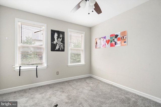 15 N Belnord Ave, Baltimore, MD 21224 - carpeted empty room with healthy amount of natural light and a ceiling fan