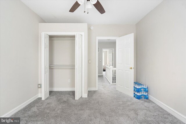 15 N Belnord Ave, Baltimore, MD 21224 - unfurnished bedroom with carpet, a closet, and a ceiling fan