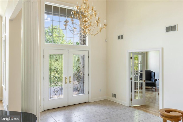 2630 Eagle Ln, Hellertown, PA 18055 - entryway featuring french doors, a high ceiling, a chandelier, tile patterned flooring, and baseboards