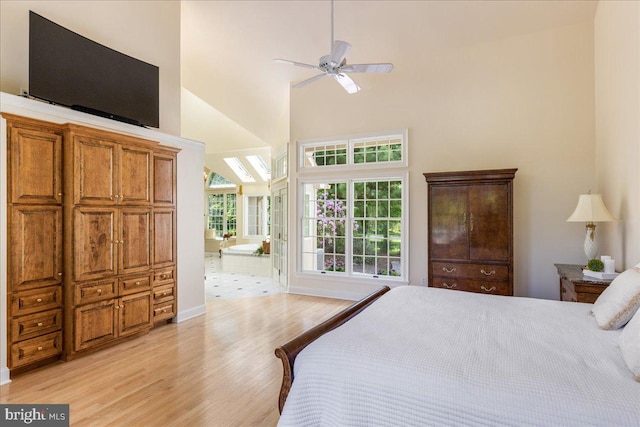 2630 Eagle Ln, Hellertown, PA 18055 - bedroom with light wood-style floors, high vaulted ceiling, ensuite bath, baseboards, and a ceiling fan