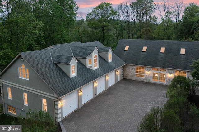 2630 Eagle Ln, Hellertown, PA 18055 - view of front of home featuring an attached garage, asphalt driveway, stone siding, and a shingled roof