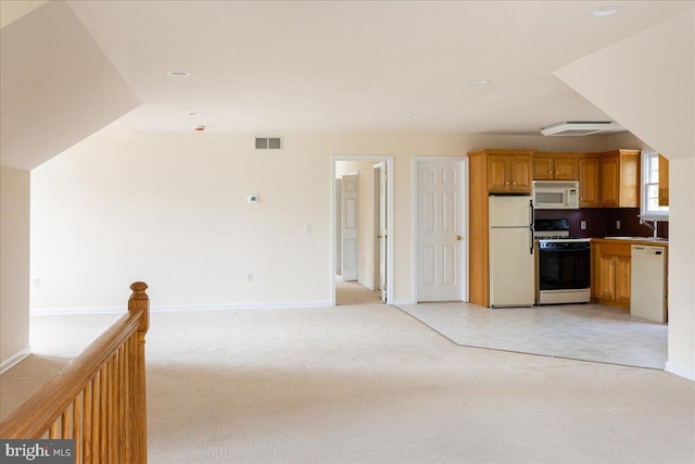 2630 Eagle Ln, Hellertown, PA 18055 - kitchen with white appliances, a sink, light carpet, open floor plan, and baseboards