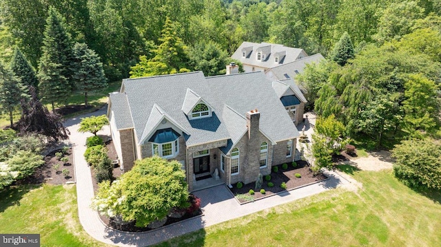 2630 Eagle Ln, Hellertown, PA 18055 - view of front of house with a forest view, a chimney, and a front yard