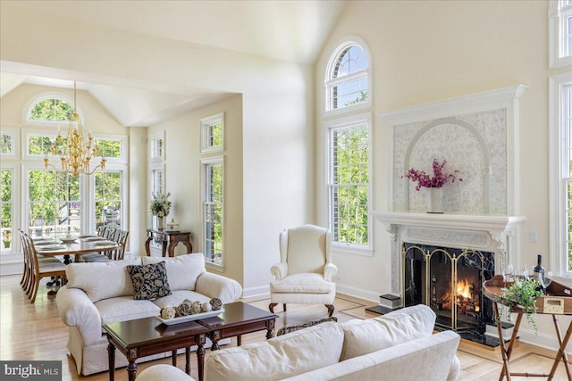 2630 Eagle Ln, Hellertown, PA 18055 - living room with high vaulted ceiling, a premium fireplace, a chandelier, baseboards, and wood finished floors