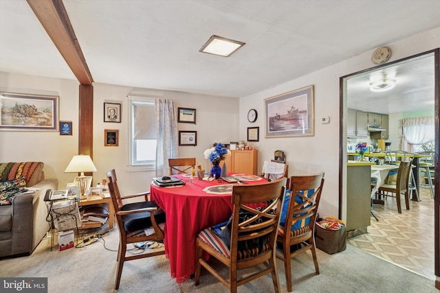 dining space with carpet flooring